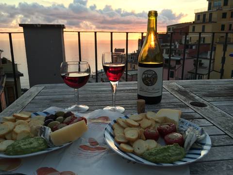 Image Title: October Sunset Dinner on the Rooftop Terrace in Riomaggiore. [Photo: Open Door Travelers]