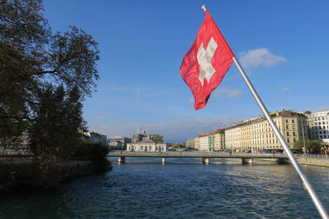 Image Title: Swiss Flag from Mont Blanc Bridge. [Photo: Open Door Travelers]