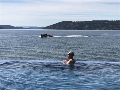 Image Title: The Infinity Pool overlooking the Lake at the Coeur d'Alene Resort. [Photo: Open Door Travelers]
