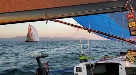 Image Title: Transpac 52 Sonic in a sunset drag race for line honors with Transpac 52 Glory outside of Race Rocks. 
[Photo: Sonic Crew Member, Brian Davies]