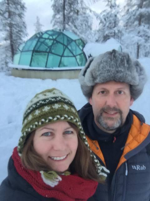 Image Title: Arctic Selfie in front of our Glass Igloo [Photo: Open Door Travelers]