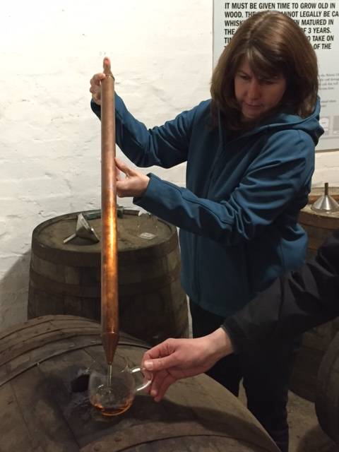 Image Title: Pulling our own dram from the Cask [Photo: Open Door Travelers]