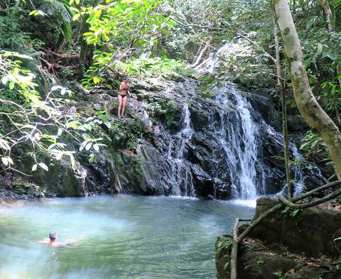 Image Title: Waterfall Jumping in the Mayflower Bocawina National Park, Belize. [Photo: Open Door Travelers]