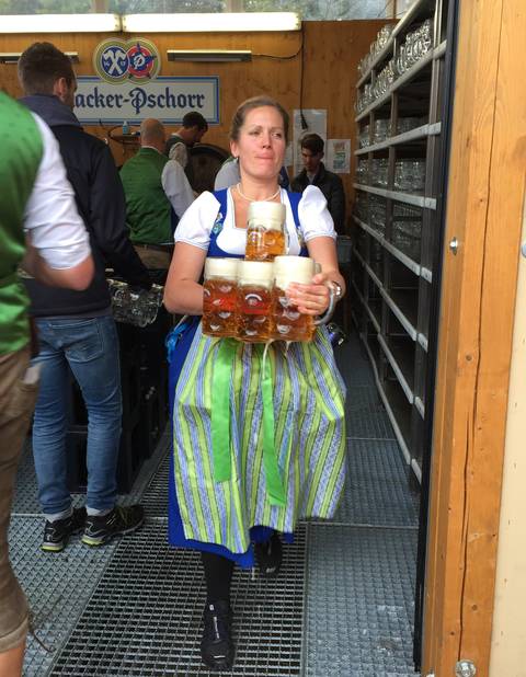 Image Title: An authentic St. Pauli Girl at the Pauliner Beer Tent. [Photo: Open Door Travelers]