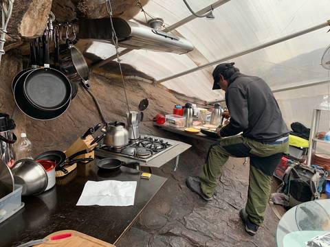 Image Title: The dining pod gally where our guide is preparing a gourmet meal. [Photo: Open Door Travelers]