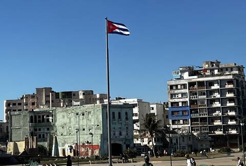 Image Title: And finally, the Cuban Flag proudly flying over central Havana. [Photo Credit: Open Door Travelers]